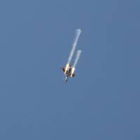 A picture taken on Thursday shows a Syrian army jet firing rockets over the village of Rahbet Khattab in the Hama province. Jihadists and allied rebels claimed more ground against Syrian government forces in central Hama province, the Syrian Observatory for Human Rights monitor said. Syrian army prepares Hama counterattack as rebels score gains ahead of peace talks