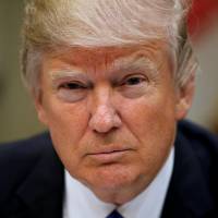 U.S. President Donald Trump hosts a House and Senate leadership lunch at the White House in Washington on March 1. Trump earned $153 million and paid $36.5 million in taxes in 2005