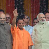 Uttar Pradesh Chief Minister Yogi Adityanath (center), Indian Prime Minister Narendra Modi (right) and Bharatiya Janata Party President Amit Shah attend Adityanath’s swearing-in ceremony as chief minister in Lucknow, the state capital, on Sunday. Hard-line priest's elevation a sign Modi is putting India on path toward becoming a Hindu nation