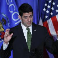 House Speaker Paul Ryan crosses his fingers while speaking at a campaign rally in Janesville, Wisconsin, Nov. 8. Trump says Republican health care bill just 'framework' and he's open to tweaking