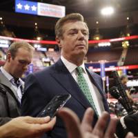 Paul Manafort talks to reporters on the floor of the Republican National Convention at Quicken Loans Arena in Cleveland on July 17. Manafort, President Donald Trump’s former campaign chairman secretly worked for a Russian billionaire to advance the interests of Russian President Vladimir Putin a decade ago and proposed an ambitious political strategy to undermine anti-Russian opposition across former Soviet republics, The Associated Press has learned. Former Trump campaign chairman Manafort secretly worked for Russian billionaire to help Putin a decade ago