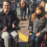Unimpeded access: Paralympic athlete Kazumi Nakayama attends a tour of Tokyo’s Shibuya Ward led by Accessible Japan’s Josh Grisdale (left). 'Barrier-free' tour of Tokyo offers a vision of what could be