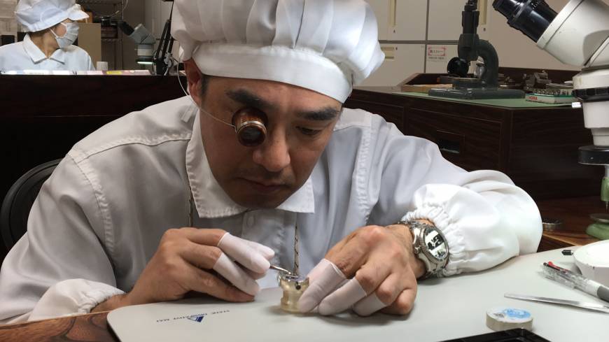 Katsuo Saito, another master craftsman of Seiko, assembles a watch at Shizukuishi Watch Studio in March. | CHIHO IUCHI