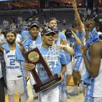 North Carolina celebrates after winning the South Region on Sunday in Memphis, Tennessee. South Carolina beats Florida to reach first Final Four