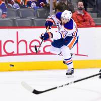 Edmonton’s Leon Draisaitl scores an empty-net goal in the third period against Colorado on Thursday night in Denver. The Oilers defeated the Avalanche 7-4. Oilers erupt for five goals in third period