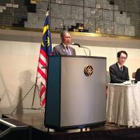 Malaysia’s Minister of International Trade and Industry Mustapa Mohamed delivers his keynote address during a Malaysia business seminar in Tokyo on April 12. Malaysia seeks to entice Japanese investors
