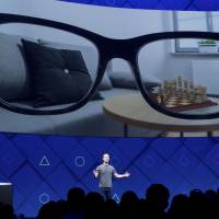 Facebook CEO Mark Zuckerberg speaks at his company’s annual F8 developer conference Tuesday in San Jose, California. Zuckerberg says augmented reality strategy to start with smartphones