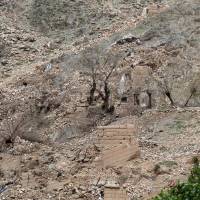 Burned trees are seen Sunday at the site of the MOAB, or “mother of all bombs,” which struck the Achin district of the eastern province of Nangarhar, Afghanistan. Few clues on impact where largest U.S. bomb was dropped in Afghanistan