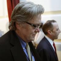 White House chief strategist Steve Bannon walks last month on Capitol Hill in Washington. President Donald Trump removed Bannon from the National Security Council, reversing an earlier controversial decision to give Bannon access to the high-level meetings. Trump dumps Bannon from NSC amid rumors of clash with McMaster