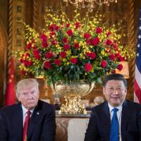 U.S. President Donald Trump sits with Chinese President Xi Jinping during a bilateral meeting at Trump’s Mar-a-Lago estate in Palm Beach, Florida, on April 6. Trump warms to Xi, but risks leaving allies out to dry