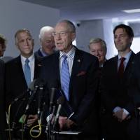 Senate Judiciary Committee Chairman Sen. Charles Grassley, R-Iowa, accompanied by GOP members of the panel, speak to reporters on Capitol Hill in Washington Monday after they voted in favor of President Donald Trump’s Supreme Court pick, Neil Gorsuch, and to send the nomination to the Senate floor for debate and vote. From left are Sens. John Kennedy, R-La.; Thom Tillis, R-N.C.; John Cornyn, R-Texas; Grassley; Lindsey Graham, R-S.C.; Ben Sasse, R-Neb.; and Ted Cruz, R-Texas. Republicans plan 'nuclear option' after Democrats ready filibuster against Gorsuch