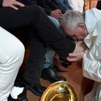 Pope Francis washes the feet of some inmates at the Paliano prison, south of Rome, Thursday. Pope visits prison, washes feet of Mafia snitches in Easter ritual