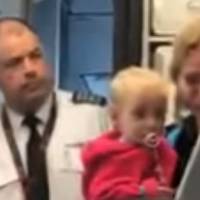This screen shot from a video taken by an American Airlines passenger shows a flight attendant and a mother who allegedly was the target of aggressive action from him. In latest airline incident, American tries to learn from United's mistakes