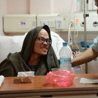 Taiwanese trekker Liang Sheng-yueh, who was rescued after being stranded in the Himalayas for 47 days, looks on in a hospital in Kathmandu on Wednesday. Taiwan trekker missing 47 days rescued from Nepal gorge; partner dead