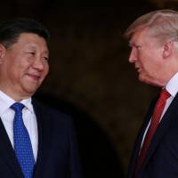 U.S. President Donald Trump welcomes Chinese President Xi Jinping at his Mar-a-Lago estate in Palm Beach, Florida, on April 6. China's Xi restructures military, consolidates control