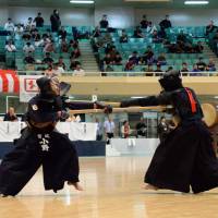 Jukendo martial art players participate in a national championship held at Tokyo’s Nippon Budokan in August 2014. The sport, mostly practiced by Self-Defense Forces personnel, will be included on the list of martial arts that can be taught at junior high schools. Prewar bayonetting martial art makes return to schools