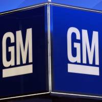 The General Motors Corporation logo is seen during the North American International Auto Show in Detroit in 2005. Two U.S. owners of General Motors diesel pickup models sued the giant automaker Thursday, claiming it had used emissions-cheating devices similar to those in Volkswagen’s global “dieselgate” scandal. GM pickup owners sue, alleging emissions cheating