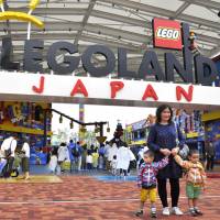 Visitors enter Legoland in Nagoya on May 1. The theme park said it will offer discount tickets for families in response to complaints that the park is too expensive. Legoland Japan offers family discounts after complaints about high fees