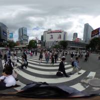 People walk through the famed scramble crossing near Shibuya Station in Tokyo. Household spending dropped again in April as consumers kept a tight hold on their purse strings. Household spending in Japan declined again in April