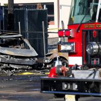 Wreckage is seen at the site where a Learjet 35 crashed in Carlstadt, New Jersey, Monday. Wind was concern but no problems reported in minute before Learjet's fatal plunge near NY