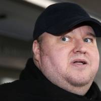 Kim Dotcom leaves court in Auckland on Dec. 23, 2015, after a judge ruled that he and three other defendants were eligible for extradition to the U.S. Kim Dotcom drops out of his party's New Zealand election bid