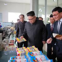 This undated picture released from North Korea’s official Korean Central News Agency (KCNA) on Wednesday shows North Korean leader Kim Jong Un (center) visiting the Rangnang Disabled Soldiers’ Essential Plastic Goods Factory in Pyongyang. Pentagon experts see “shortcomings” for now in the North’s quest for an ICBM capable of reaching the U.S. Pentagon agency sees 'important shortfalls' in North Korea ICBM quest, for now