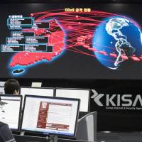 Employees watch electronic boards to monitor possible ransomware cyberattacks at the Korea Internet and Security Agency in Seoul on May 15. Cybersecurity firm Symantec Corp. said Monday it was “highly likely” that a hacking group affiliated with North Korea was behind this month’s “WannaCry” cyberattack. Symantec says 'highly likely' North Korea group behind 'WannaCry' ransomware attacks