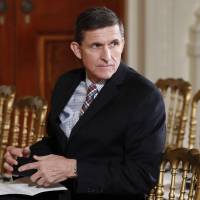 Then-National Security Adviser Michael Flynn sits in the East Room of the White House in Washington Feb. 10. President Barack Obama warned Donald Trump against hiring Flynn as national security adviser during an Oval Office meeting in the days after the 2016 election, according to three former Obama administration officials. Obama warned Trump in November not to tap Flynn as national security adviser: ex-aide