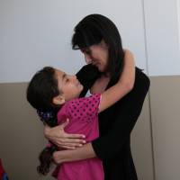 U.S. Ambassador to the United Nations Nikki Haley hugs a Syrian refugee on Wednesday during her visit to the Boynuyogun refugee camp near Hatay, Turkey. Who welcomes the most refugees? Most mistakenly think it's the West, survey says