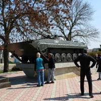 People view a Soviet armored personnel carrier placed as a monument in the center of Tiraspol, the capital of the self-proclaimed Moldovan Republic of Transnistria, on April 3. Moldova's 'frozen conflict' over breakaway Transnistria has lessons for east Ukraine