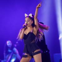 In this Aug. 26, 2015 file photo, Ariana Grande performs during at a concert in Jakarta. Ariana Grande cancels tour dates after Manchester attack