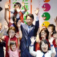 Chiba Mayor Toshihito Kumagai celebrates his election victory Sunday with supporters in the city of Chiba. Chiba Mayor Kumagai wins third four-year term