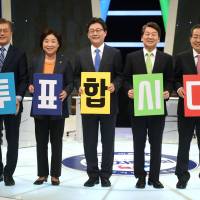 South Korean presidential candidates Moon Jae-in of the Democratic Party of Korea (From left to right), Sim Sang-jung of the Justice Party, Yoo Seung-min of the Bareun Party, Ahn Cheol-soo of the People’s Party and Hong Joon-pyo of the Liberty Korea Party pose with placards reading “Let’s vote” before a televised debate on April 28 in Seoul. Anti-Japanese rhetoric of South Korean presidential campaign won't survive geopolitical reality, experts say