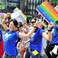 People march through Tokyo’s Shibuya district on Sunday during the Tokyo Rainbow Pride parade. This year’s theme was “Change,” a call to respect everyone as individuals, regardless of sexuality. Tokyo Rainbow Pride participants march for 'change' in LGBT recognition
