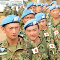 Ground Self-Defense Force members from the United Nations Mission in South Sudan prepare to board a plane as they withdraw from their mission in Juba in May. Experts question wisdom, achievements of SDF South Sudan peacekeeping mission