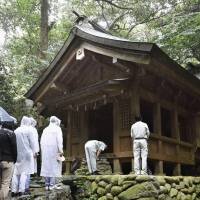 People visit Okitsu shrine, a part of the Munakata Grand Shrine, on Okinoshima, a remote island in Fukuoka Prefecture, last September. A UNESCO advisory body has recommended the island, an ancient religious site, be added to the World Heritage list. Sacred men-only island set to be granted UNESCO World Heritage status