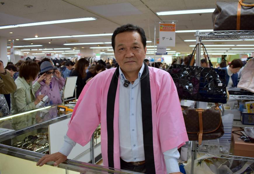 Saneyoshi Yogi, head of PX Co., attends a market of unclaimed goods in Saikaya department store in Fujisawa, Kanagawa Prefecture.