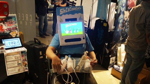 Living in a box: Flash Games Japan finds an unusual way to promote its “ShCoCoooCoCo” game. Unusual controllers preside at BitSummit