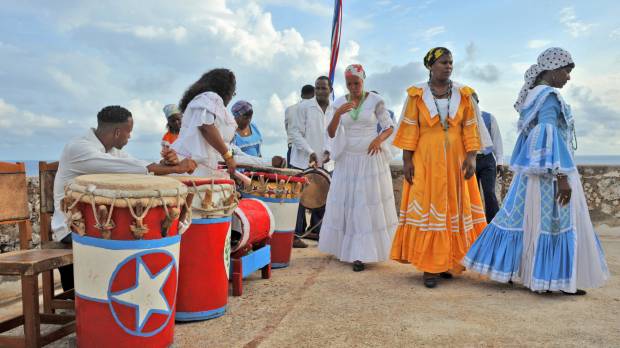 Guardians of culture: Members of La Caridad de Oriente prepare to perform the Tumba Francesa atop San Pedro de la Roca castle in Santiago de Cuba. Looking for 'omotenashi' in Cuba's southeast