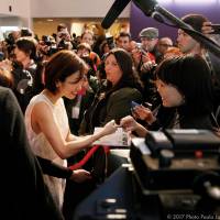 Overseas outreach: Actress Aya Ueto signs an autograph at the recent Udine Far East Film Festival. Japan's filmmakers expand their idea of overseas opportunity
