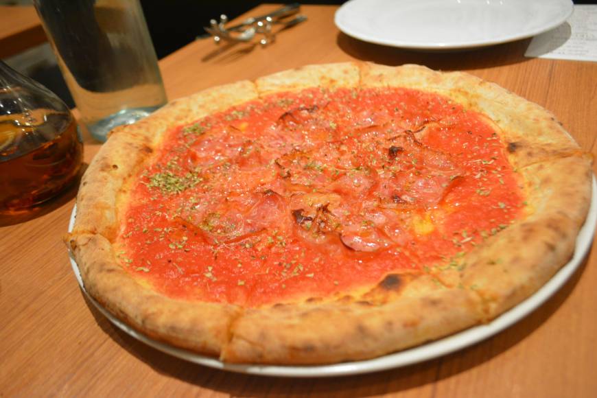 Al Camino Simple pleasures: Al Camino's con panchetta comprises San Marzano tomato sauce, garlic, oregano and crispy pancetta. | J.J. O'DONOGHUE