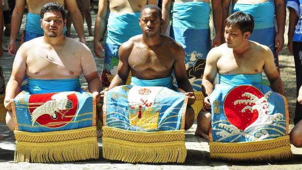 Tim Franklin is flanked by fellow sumo wrestlers during his spell in Okinawa on the JET Programme. Thirty years of JET: countless treasured memories and priceless gaffes