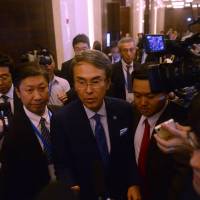 Economic and fiscal policy minister Nobuteru Ishihara speaks to reporters after a Trans-Pacific Partnership meeting Sunday on the sidelines of the Asia-Pacific Economic Cooperation gathering in Hanoi where it was agreed to try to resuscitate the free trade pact. The TPP's second act