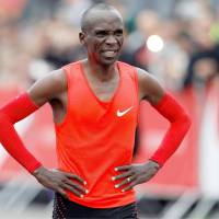 Eliud Kipchoge reacts at the finish line on Saturday in Monza, Italy, after missing his target of becoming the first person to run a marathon under 2 hours. Kipchoge misses two-hour target in pursuit of marathon speed record