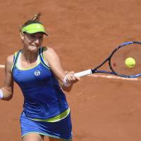 Ekaterina Makarova returns the ball to Angelique Kerber in the first round of the women’s singles at the French Open on Sunday in Paris. Makarova stuns top-ranked Kerber in first round