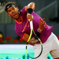 Rafael Nadal hits a shot during his victory over David Goffin in the quarterfinals of the Madrid Open on Friday. Djokovic, Nadal to meet in Madrid Open semifinal