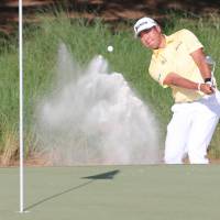 Hideki Matsuyama chips out of a bunker during the second round of The Players Championship on Friday in Ponte Vedra, Florida. Matsuyama reaches Japanese-best No. 3 in world rankings