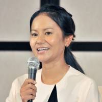 Ai Miyazato speaks during a news conference on Monday. Retiring golfer Miyazato laments loss of motivation
