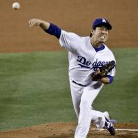 Los Angeles starter Kenta Maeda fires a pitch against the St. Louis in the third inning on Thursday. Maeda sparks Dodgers on mound, at plate