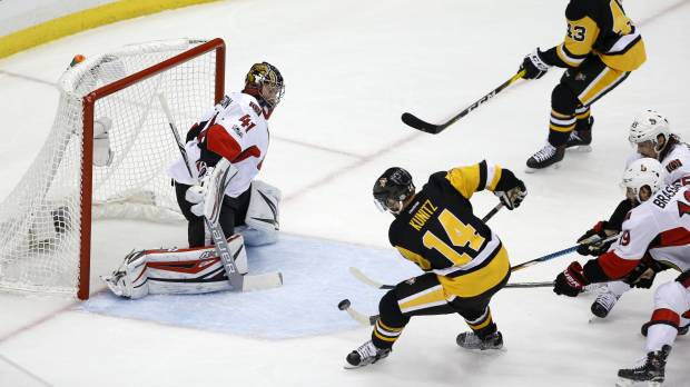 Pittsburgh’s Chris Kunitz scores a goal against Ottawa’s Craig Anderson in the second period of Game 7 on Thursday night. Pens top Sens in 2OT, make Stanley Cup Final